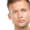 Im not sure how I feel about this. Studio portrait of a young man isolated on white